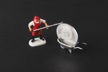 DASH coins on the black slate stone, soft focus background