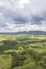Fototapeta na wymiar Beautiful mountainous landscape in the interior of Brazil. Some farms, a small town and some plantations are visible