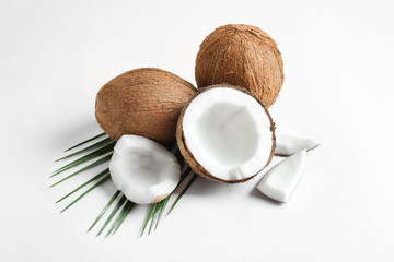 Ripe coconuts on white background