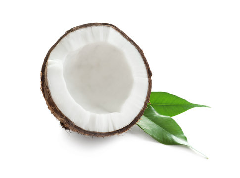 Half of coconut with leaves on white background
