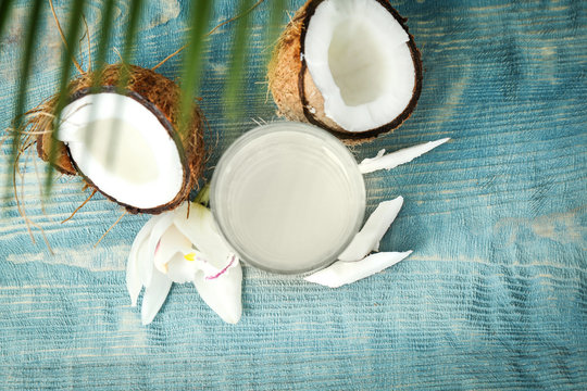 Glass Of Coconut Water On Wooden Table