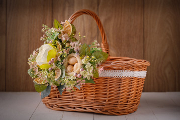 Fototapeta na wymiar The basket is decorated with flowers. Decoration for the interior.