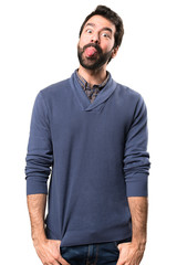 Fototapeta premium Handsome brunette man with beard making a joke on white background