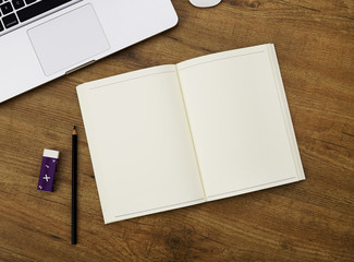 Blank notebook on a working desk