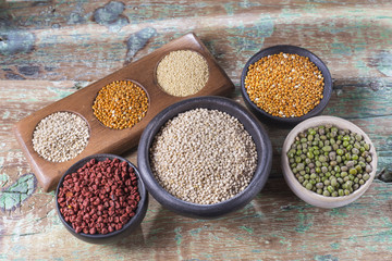 collection of super foods in several containers arranged randomly on the table