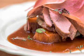 Duck with ham, sweet potatoes and meat sauce