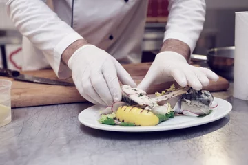 Foto op Canvas Chef is serving steamed fish, toned © Kondor83