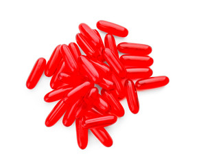 Transparent red pills on white background