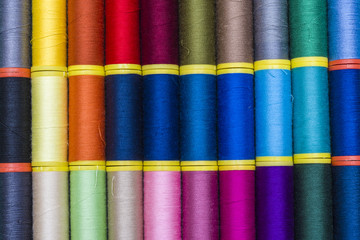 Background of colourful thread spools