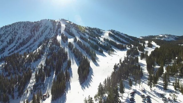 Skiiers and snowboarders enjoying a sunny day at Mt. Rose.
