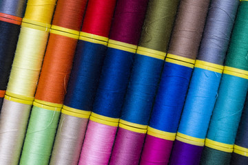 Background of colourful thread spools