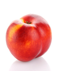 Red and ripe peach isolated