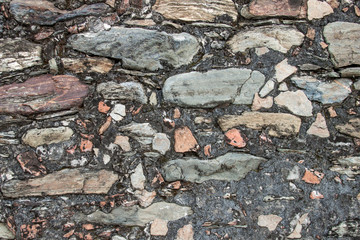 Rock pebbles pattern. Rough textured stone wall. Construction concept.