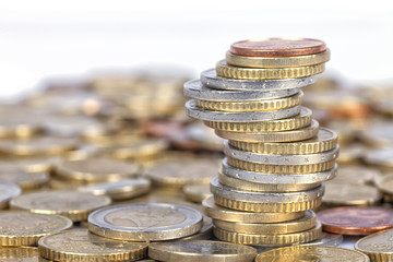 A lot of euro coins of which one part forms a column