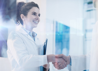Doctors shaking hands in the office