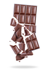 Porous chocolate broken into pieces in the air, isolated on a white background