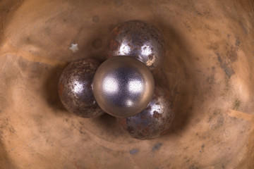 iron balls on a metal surface