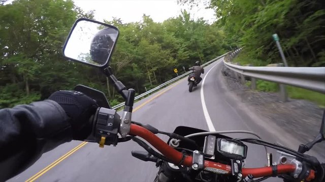supermoto in twisty mountains chesty pov gimbal view