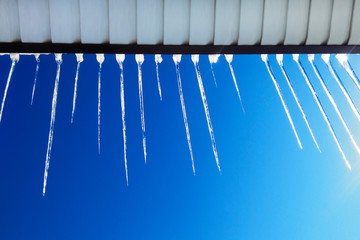 icicles on the roof, drops of spring