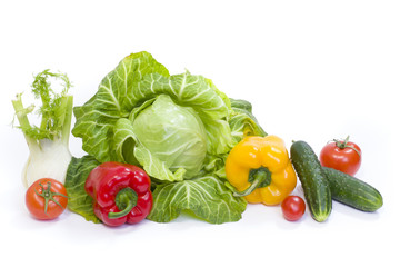 Fototapeta na wymiar Green cabbage. Yellow pepper. Red tomatoes and cucumbers on a white background.