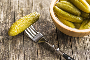 Pickles in bowl. Tasty preserved cucumbers.