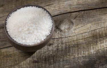 Fototapeta na wymiar White refined sugar in the bowl