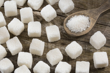 Fototapeta na wymiar White refined sugar powder and cubes