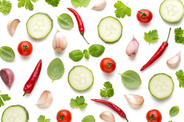 Vegetable and spices isolated on white background, top view. Wallpaper abstract composition of vegetables.