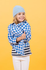 Small girl smile in hat, shirt and pants, fashion