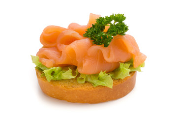 Bread with fresh salmon fillet isolated on white background, top view.