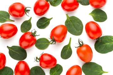 Spinach and tomato pattern background on white. Top view
