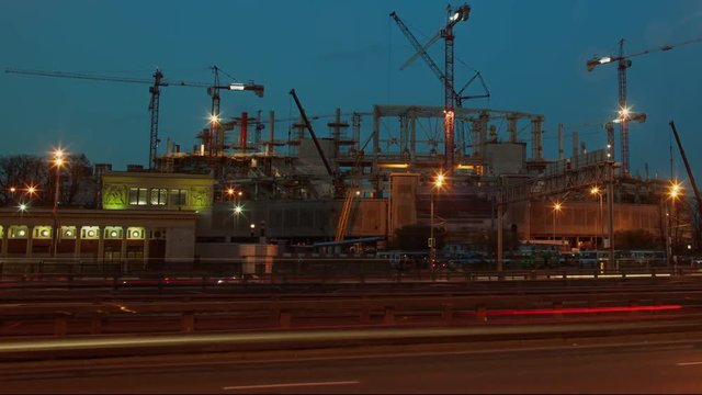  Stadium construction timelapse., cranes at work, urban traffic, industrial 