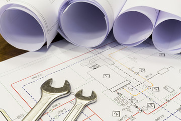 Maintenance and service: Wrench and project drawings with plumbing system
