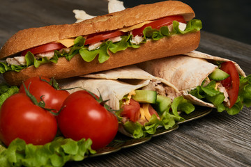 Burrito with grilled chicken and vegetables, Shawarma Sandwich, Doner Kebab, Chicken Shawarma, Subway sandwich on wooden table