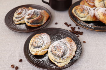 Buns of yeast dough with a poppy filling