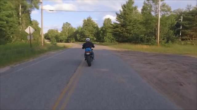 motorcycle passes gimbal camera on trip packed up sleeping bag