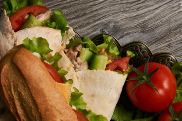 Burrito with grilled chicken and vegetables, Shawarma Sandwich, Doner Kebab, Chicken Shawarma, Subway sandwich on wooden table
