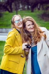 happy smiling mom and daughter