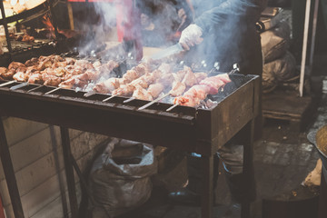 Hot food at the festival of street fast food, sausages, hot dog, fried meat