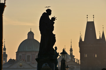 Dawn on the Charles Bridge in Prague.