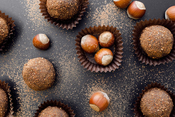 Obraz na płótnie Canvas chocolate petit four sweets with hazelnuts