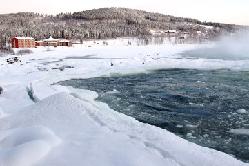 Power by nature, biggest waterfall Storforsen in winter,