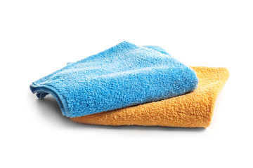 Folded clean terry towels on white background