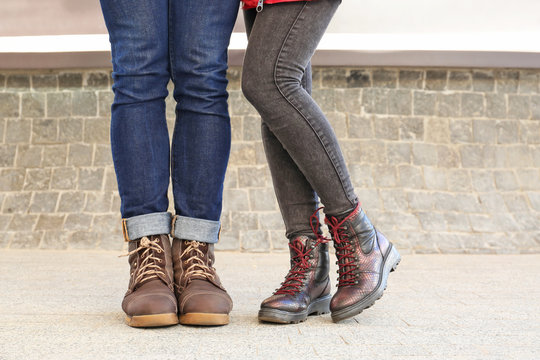 Stylish couple in comfortable shoes on city street