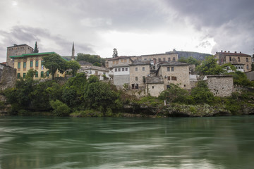 Obraz premium View of Old Town Mostar from the bank of Neretva River, Bosnia and Herzegovina.