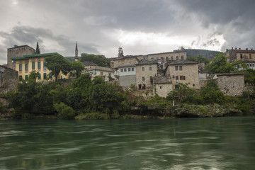 Fototapeta na wymiar View of Old Town Mostar from the bank of Neretva River, Bosnia and Herzegovina.