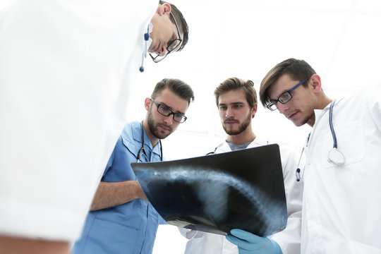 bottom view.team of doctors discussing an x-ray