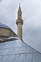 Fototapeta na wymiar Minaret and metal roof of Koski Mehmed Pasha mosque, Mostar, Bosnia and Herzegovina