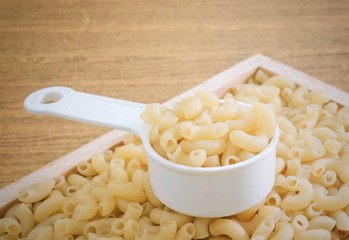 Elbow Macaroni or Gomiti Pasta in Measuring Cup