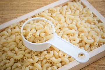 Elbow Macaroni or Gomiti Pasta in Measuring Cup